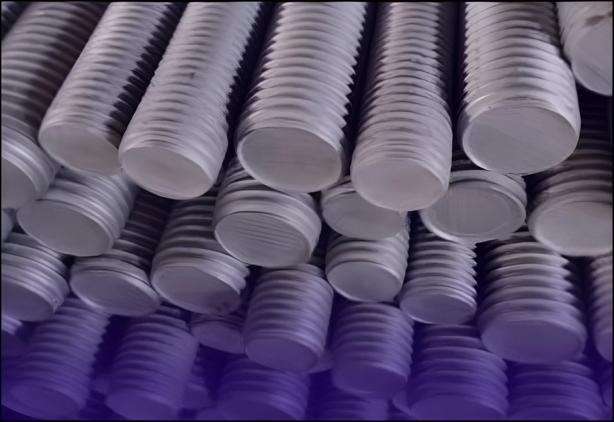 Stacked industrial pipes in warehouse